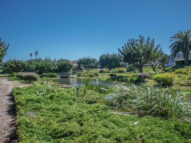 a backyard of a house with outdoor seating