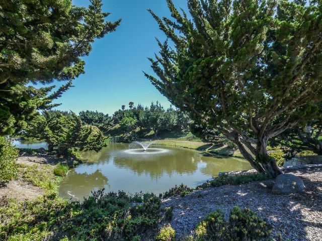 a view of a lake with a yard