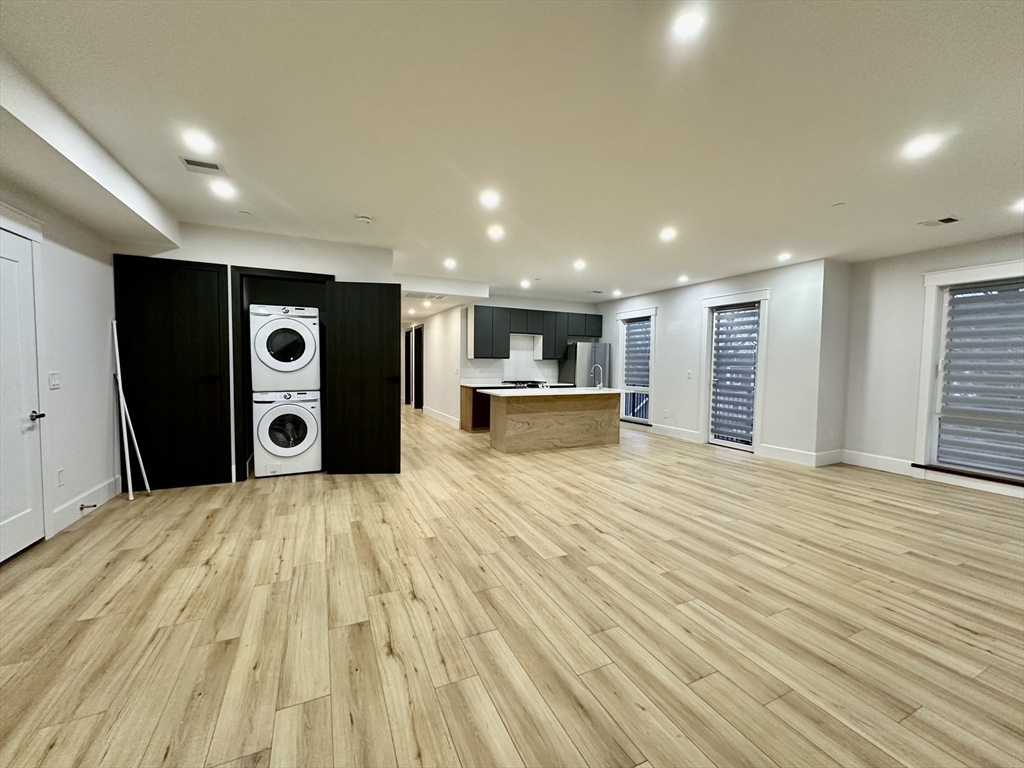 100 Mt Pleasant Avenue, Unit 4 Boston, MA 02119 - Photo 3 of 15 a view of empty room with a kitchen