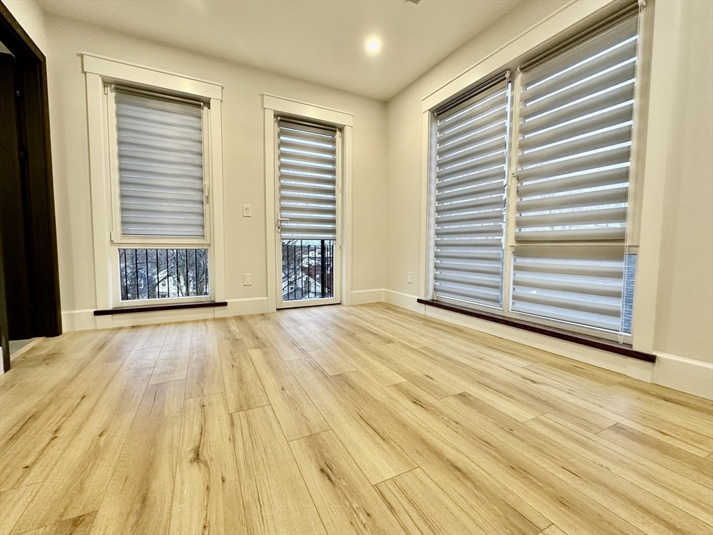 100 Mt Pleasant Avenue, Unit 4 Boston, MA 02119 - Photo 9 of 15 a view of an empty room with a window