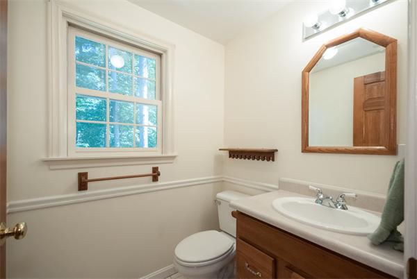 8 Aaron Drive Topsfield, MA 01983 - Photo 14 of 26 a bathroom with a granite countertop sink vanity mirror and toilet