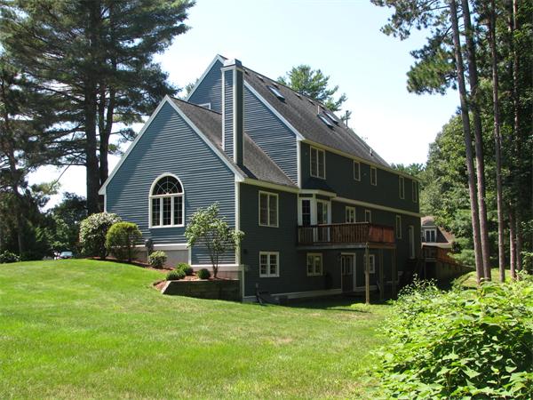 8 Aaron Drive Topsfield, MA 01983 - Photo 25 of 26 a front view of a house with a yard