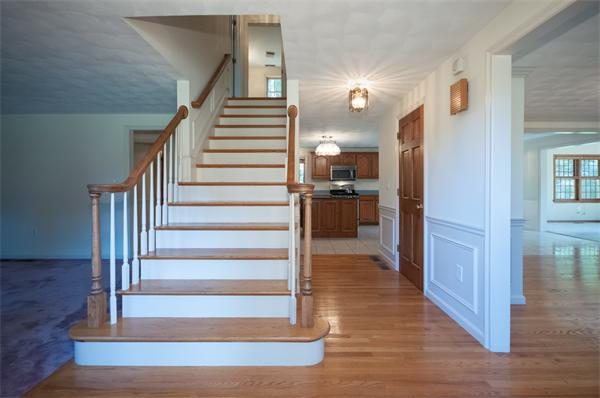 8 Aaron Drive Topsfield, MA 01983 - Photo 4 of 26 a view of entryway and hall with wooden floor