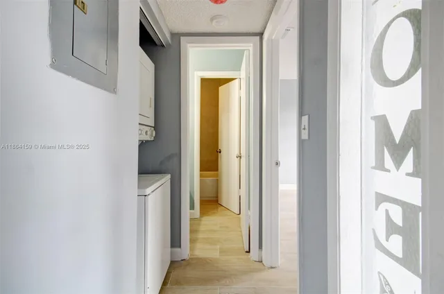 a bathroom with a granite countertop mirror and a shower