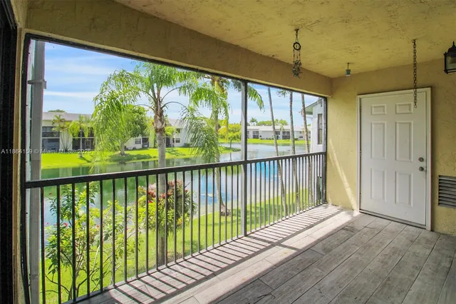 a view of balcony with wooden floor