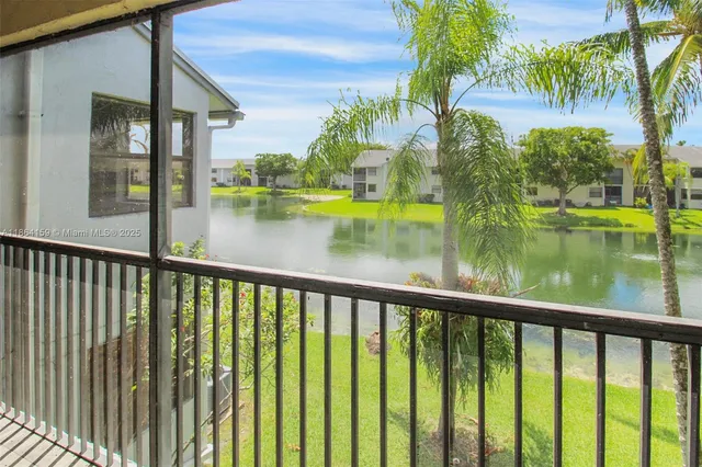 a view of swimming pool from a balcony