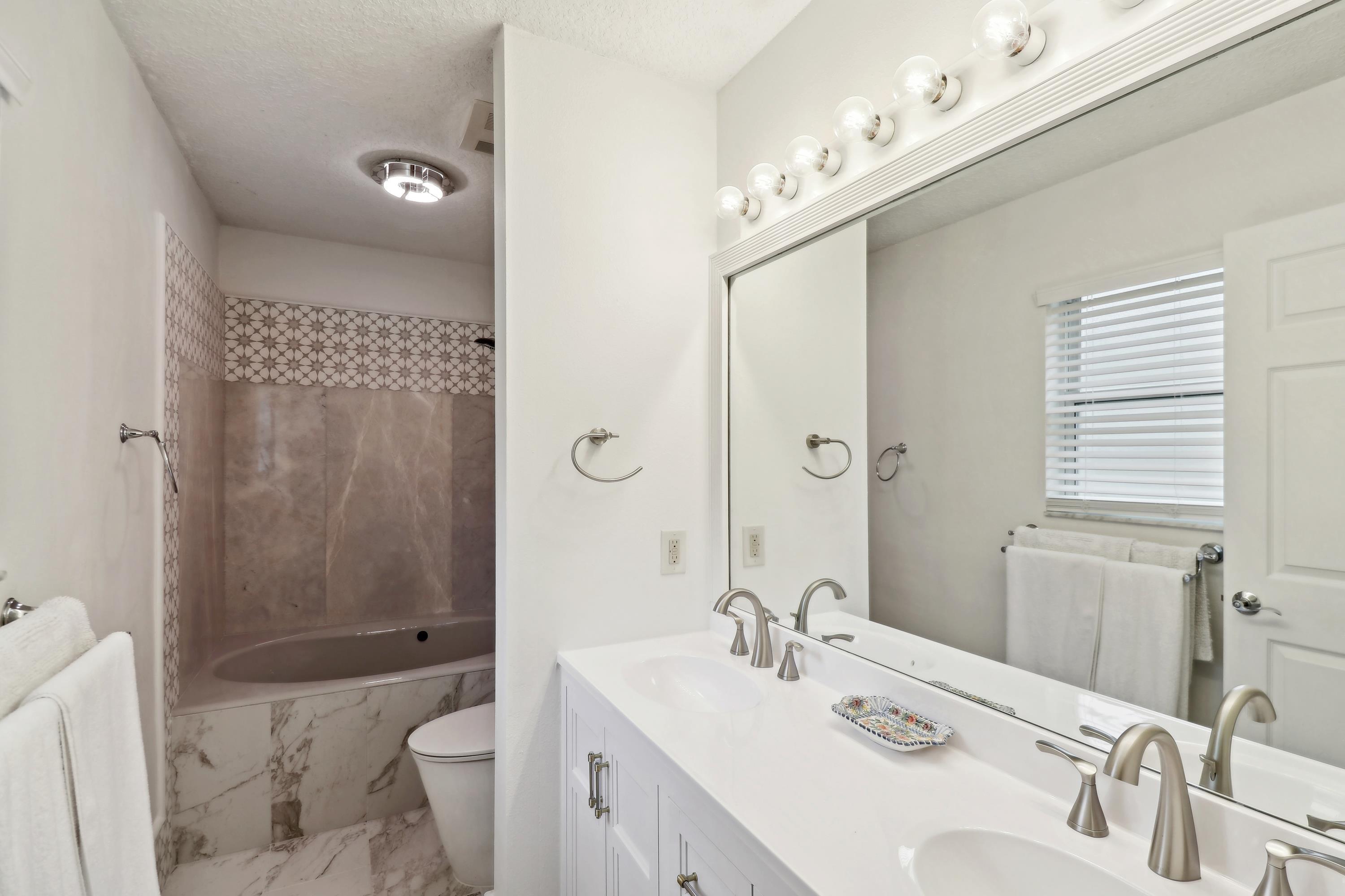 240 Jasmine Road St. Augustine, FL 32086 - Photo 25 of 30 a bathroom with a sink a toilet and shower