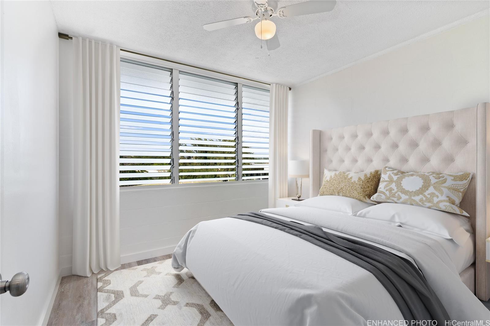 94-249 Waikele Road, Unit A307 Waipahu, HI 96797 - Photo 6 of 20 a bedroom with a bed and a window