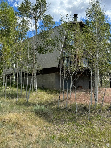 1085 West Elk Road Helper, UT 84526 - Photo 29 of 40 A-frame style exterior featuring light-colored siding and a dark roof