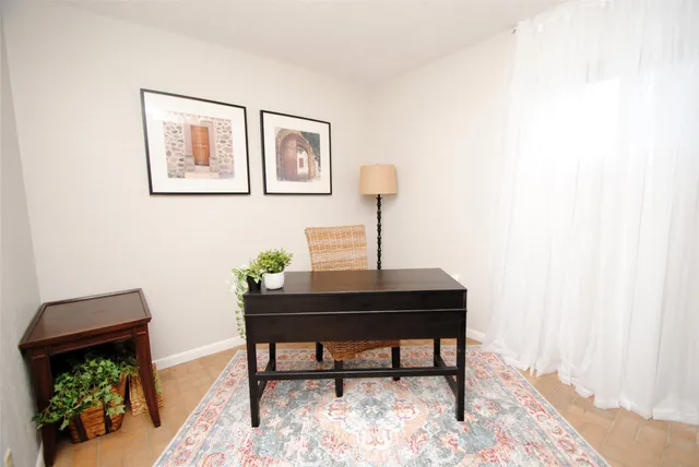 a view of a workspace with furniture