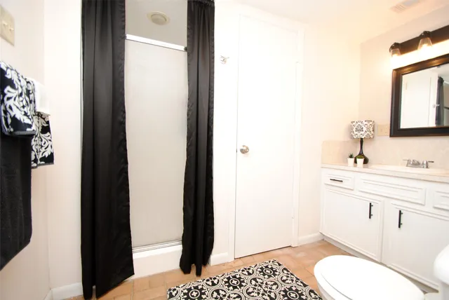 a room with pool table and flat screen tv