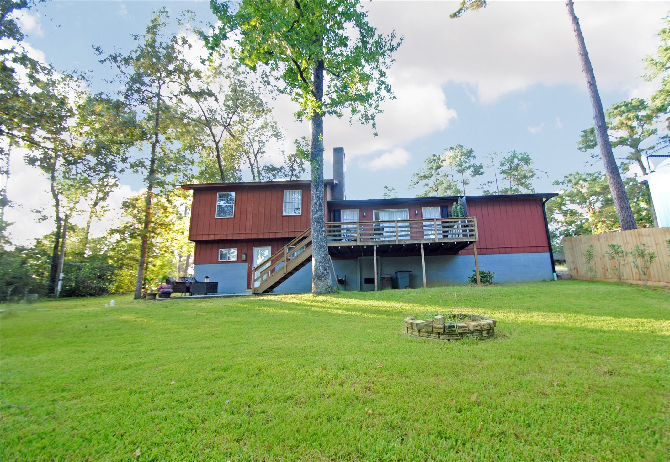 59 Paradise Loop Point Blank, TX 77364 - Photo 27 of 33 a view of a house with a yard