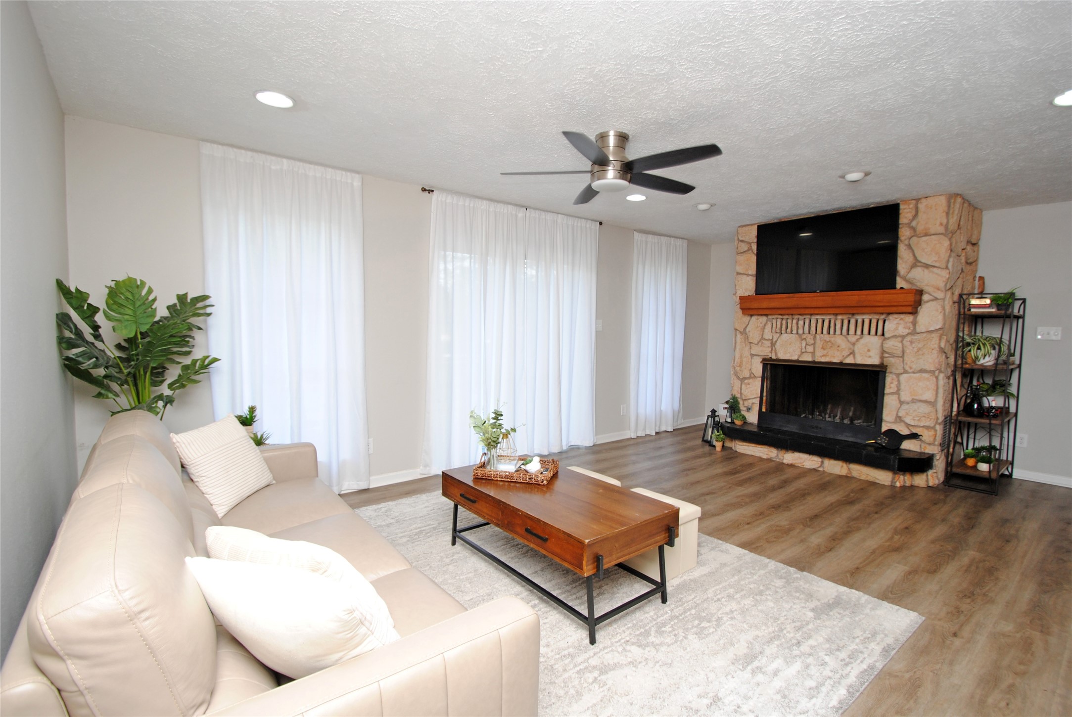 59 Paradise Loop Point Blank, TX 77364 - Photo 3 of 33 a living room with furniture fireplace and flat screen tv