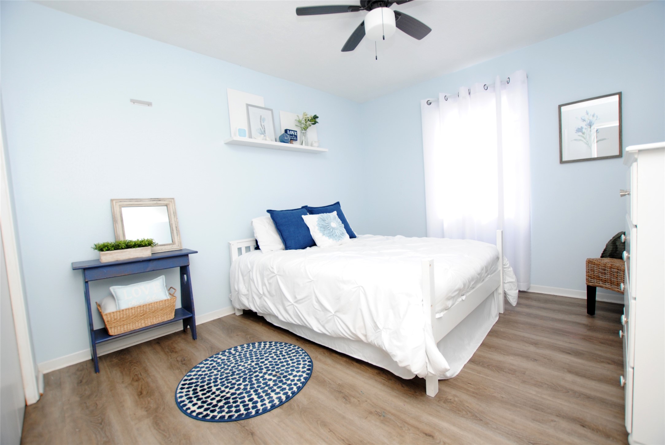 59 Paradise Loop Point Blank, TX 77364 - Photo 8 of 33 a bedroom with a bed and a table