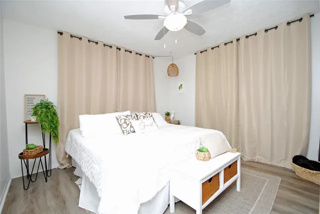 a bedroom with a bed and a chair