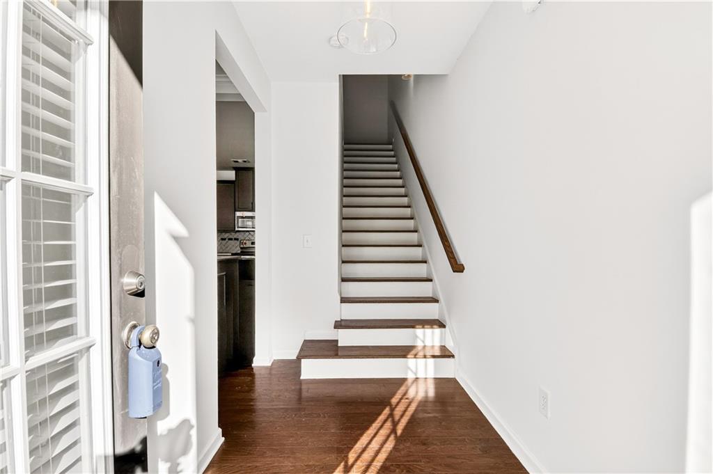 7789 Rutgers Circle Fairburn, GA 30213 - Photo 2 of 39 a view of entryway with wooden floor