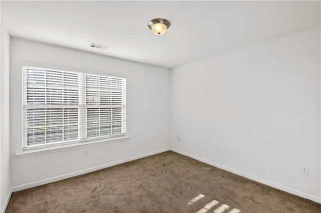 a view of a room that has a window in it