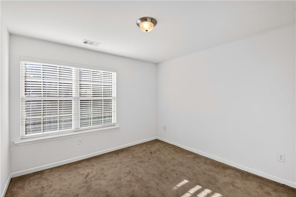 7789 Rutgers Circle Fairburn, GA 30213 - Photo 23 of 39 a view of a room that has a window in it