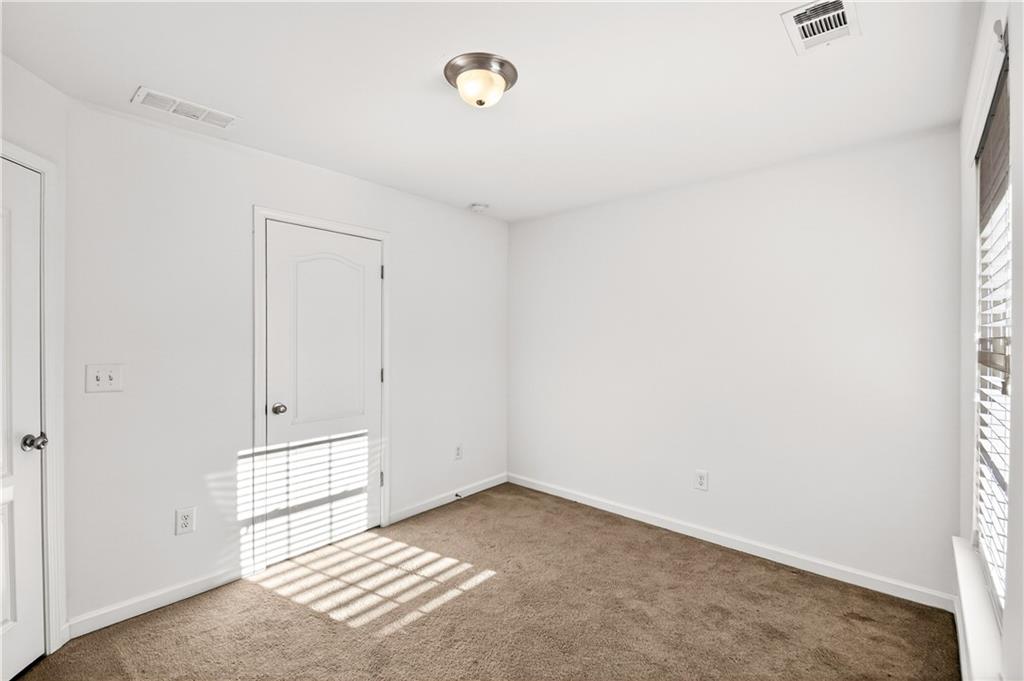 7789 Rutgers Circle Fairburn, GA 30213 - Photo 27 of 39 a view of a livingroom with an empty space