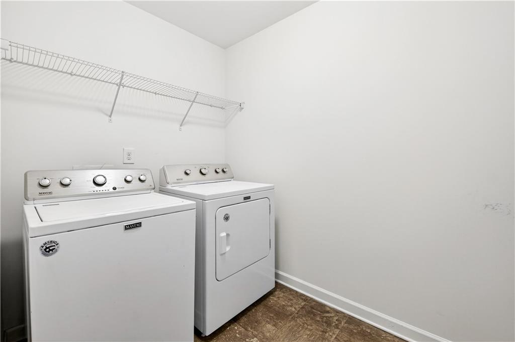 7789 Rutgers Circle Fairburn, GA 30213 - Photo 30 of 39 a utility room with dryer and washer