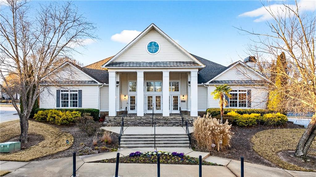 7789 Rutgers Circle Fairburn, GA 30213 - Photo 32 of 39 a front view of a house with garden