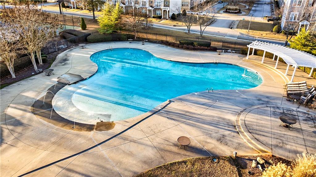 7789 Rutgers Circle Fairburn, GA 30213 - Photo 34 of 39 a view of a swimming pool with a patio