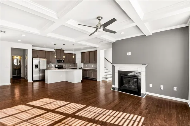 a view of a kitchen with a stove cabinets and wooden floor