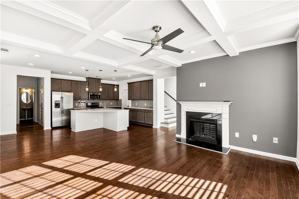 7789 Rutgers Circle Fairburn, GA 30213 - Photo 7 of 39 a view of a kitchen with a stove cabinets and wooden floor