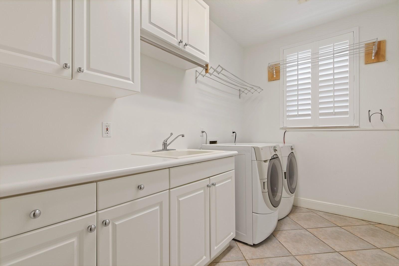 4116 Briarcliff Circle Boca Raton, FL 33496 - Photo 21 of 25 18_4116BriarcliffCircle_44_LaundryRoom_C