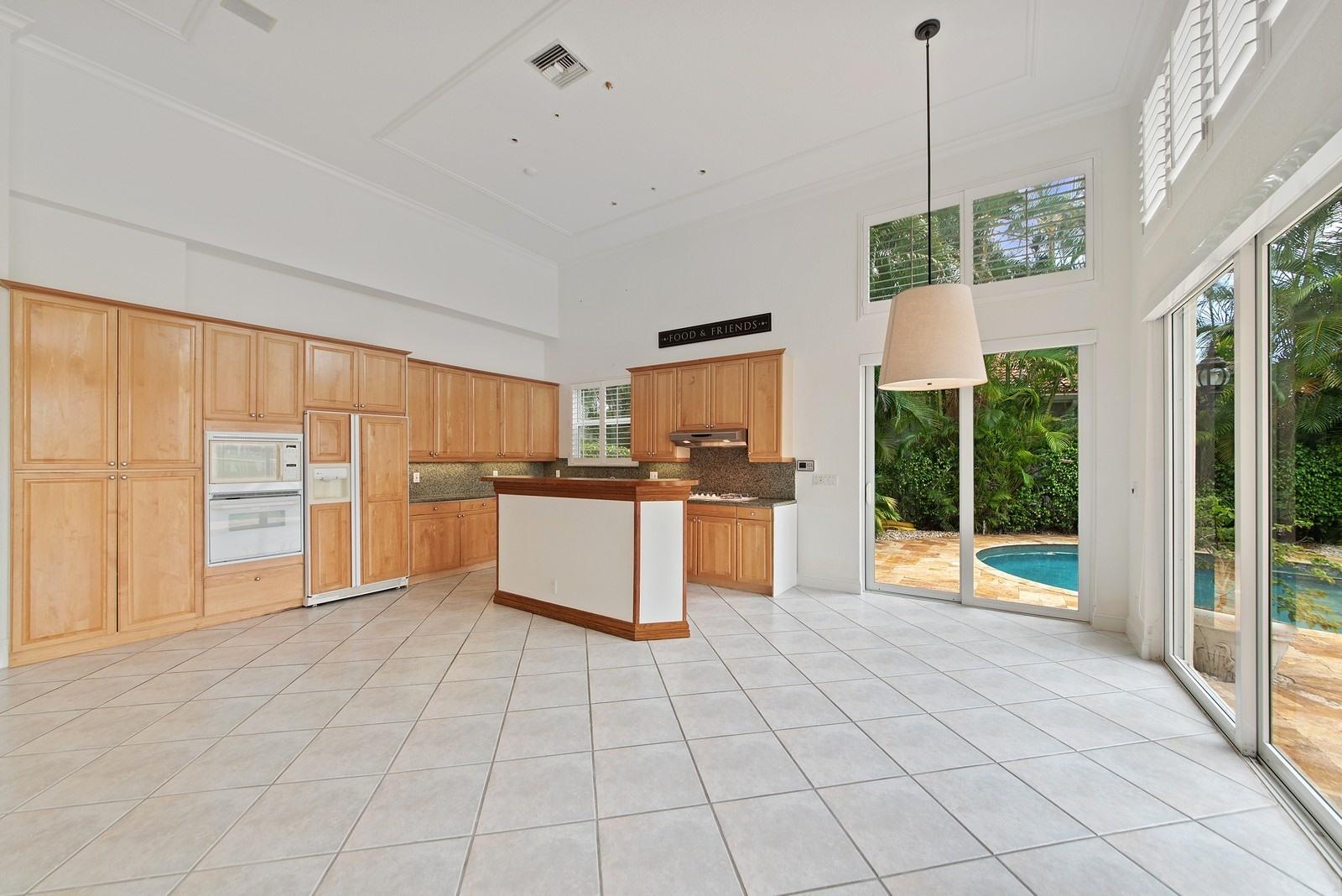 4116 Briarcliff Circle Boca Raton, FL 33496 - Photo 7 of 25 06_4116BriarcliffCircle_191_KitchenBreak