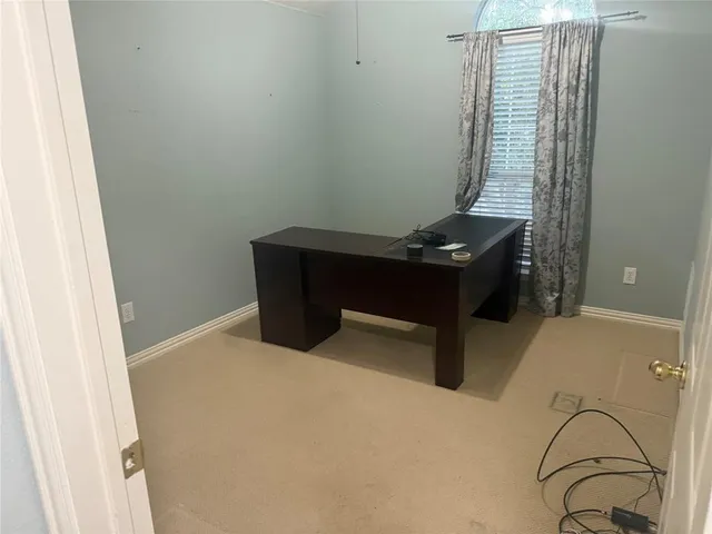 a room with windows and furniture