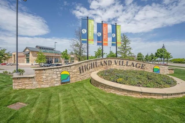 a view of a swimming pool with a garden and plants