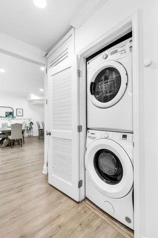 a view of a storage and utility room with washer and dryer