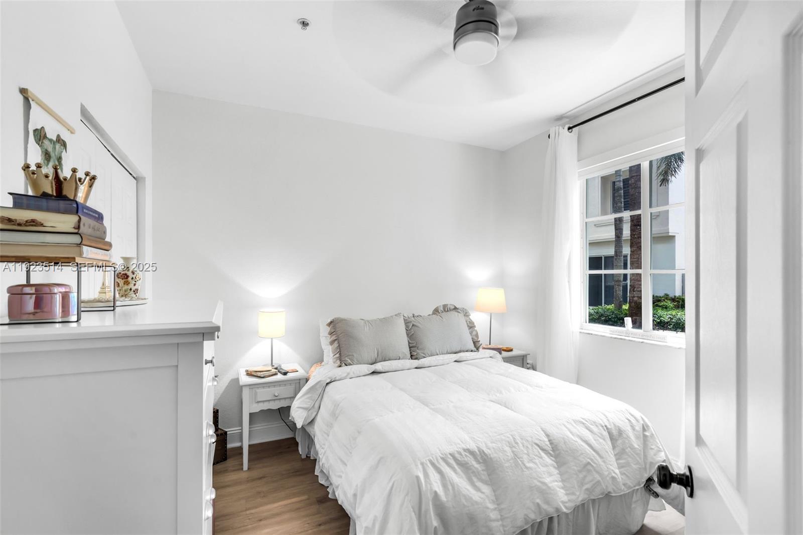 12430 Southwest 50th Street, Unit 109 Miramar, FL 33027 - Photo 15 of 28 a bedroom with a bed and a window