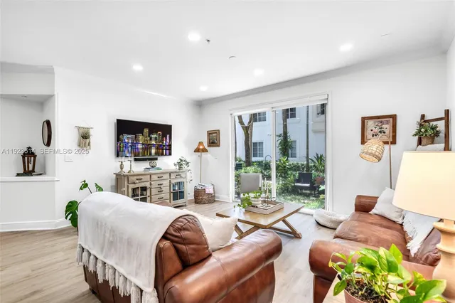 a living room with furniture fireplace and a flat screen tv