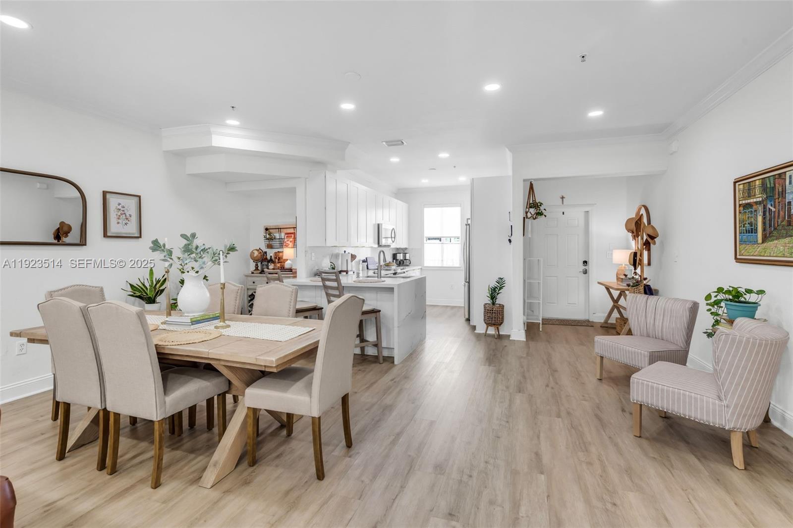 12430 Southwest 50th Street, Unit 109 Miramar, FL 33027 - Photo 9 of 28 a view of a dining room with furniture and wooden floor