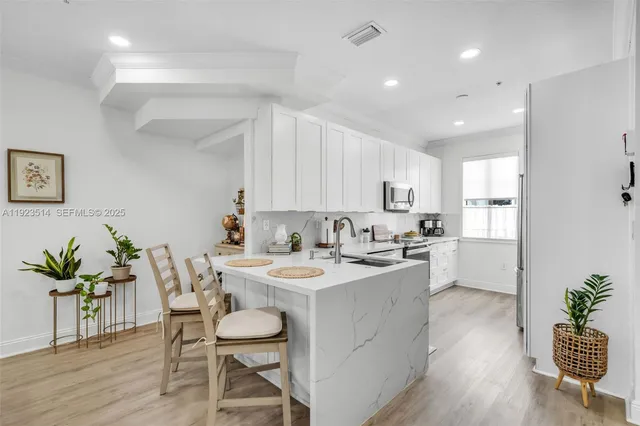a kitchen with a table and chairs in it