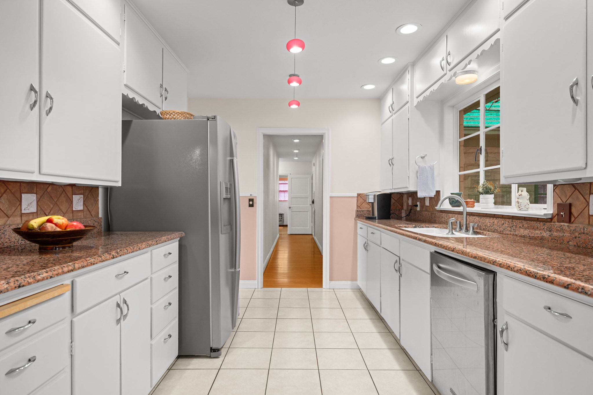 4804 Balcones Drive Austin, TX 78731 - Photo 11 of 27 a kitchen with a sink and cabinets