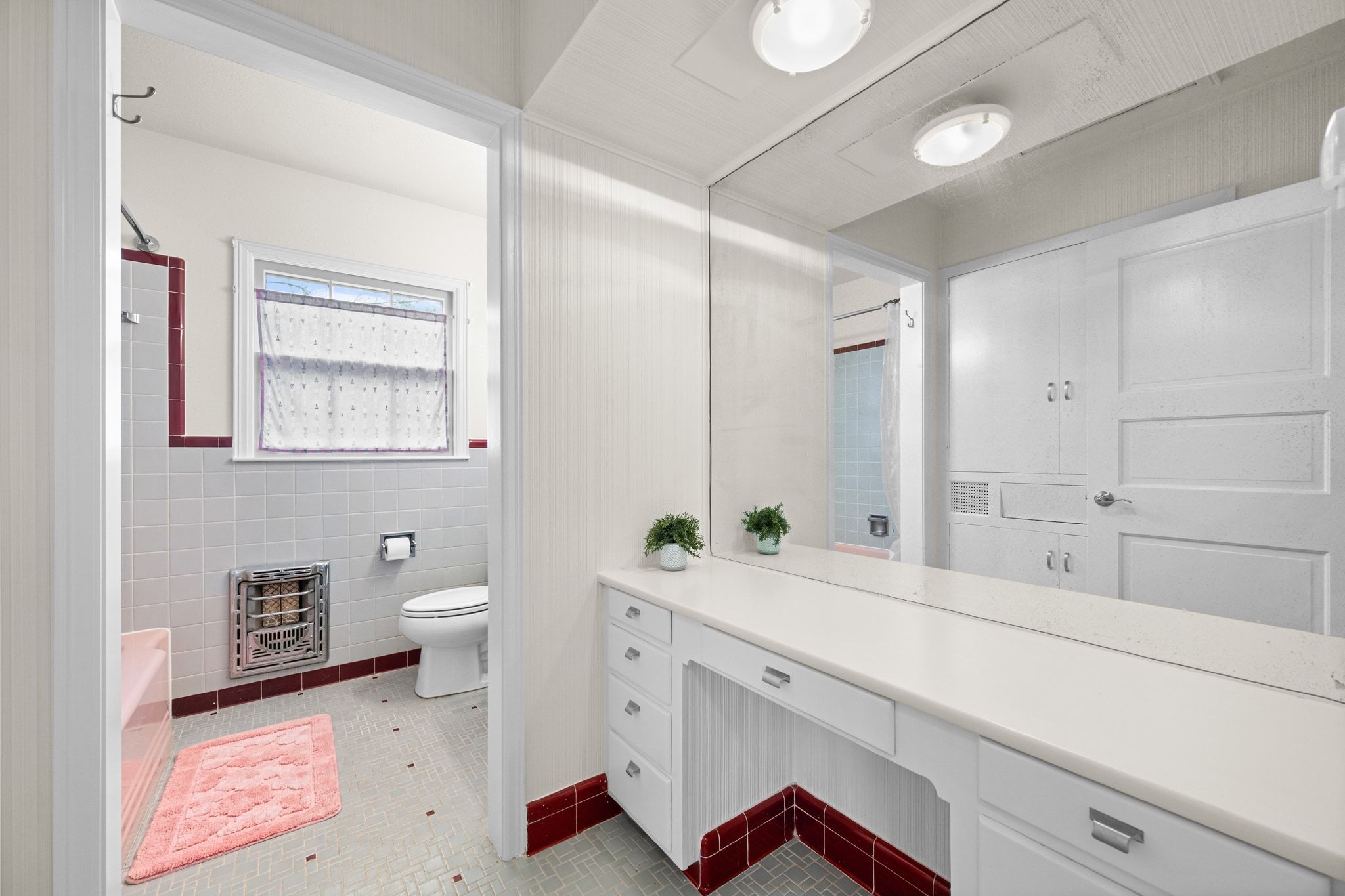 4804 Balcones Drive Austin, TX 78731 - Photo 17 of 27 a en suite bathroom with a sink and a mirror