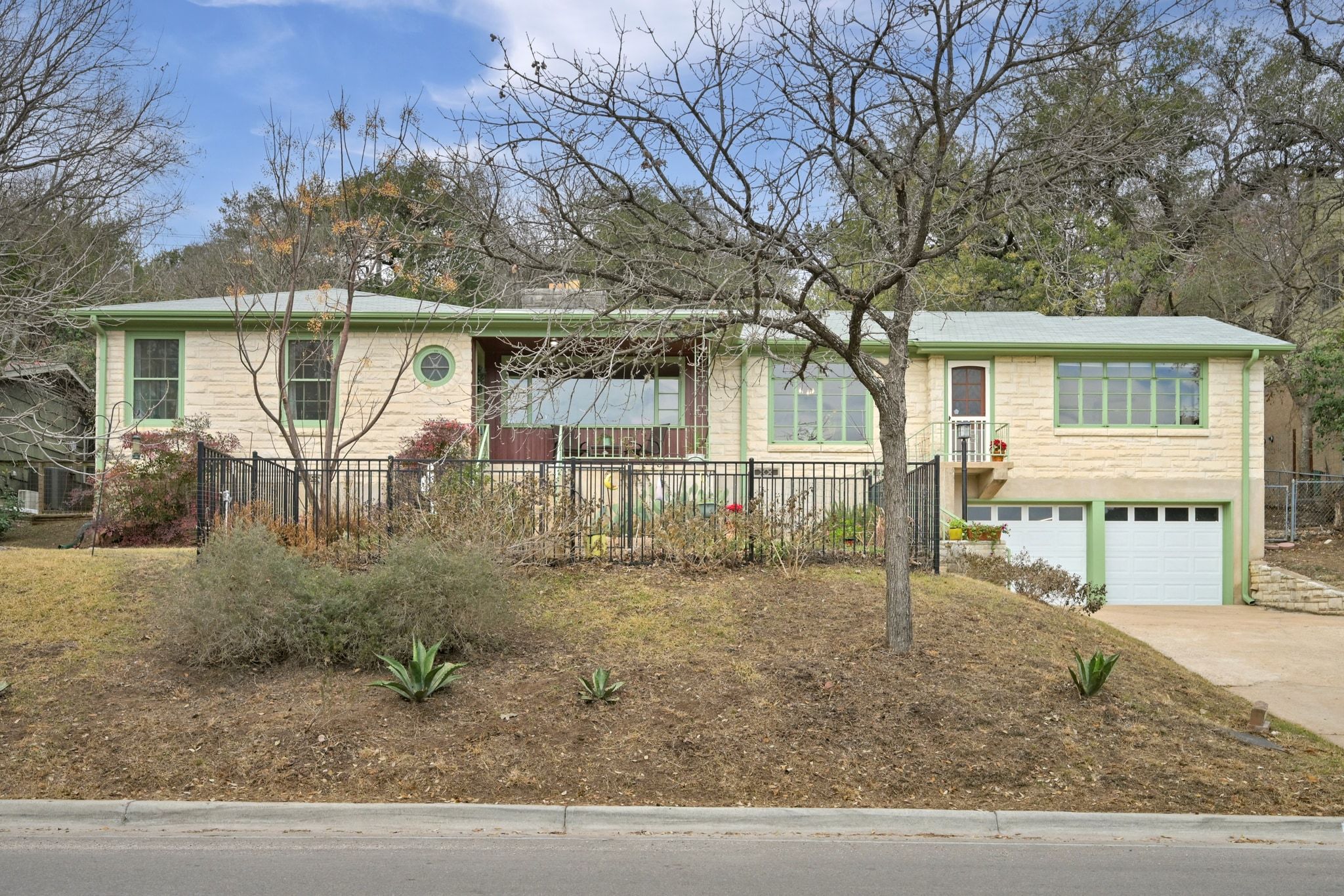 4804 Balcones Drive Austin, TX 78731 - Photo 2 of 27 front view of house with a yard