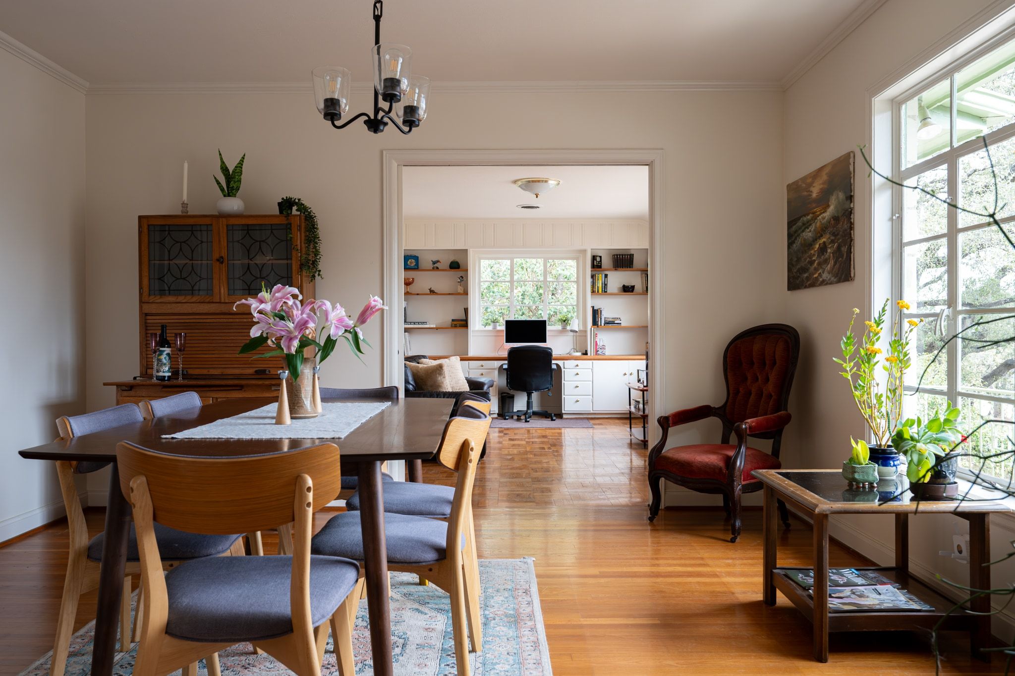 4804 Balcones Drive Austin, TX 78731 - Photo 6 of 27 a view of a dining room with furniture and a chandelier