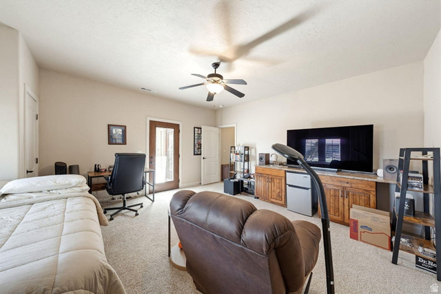 1609 East 10 S Street St. George, UT 84790 - Photo 47 of 68 Spacious room featuring neutral carpeting, a ceiling fan, and light-colored walls