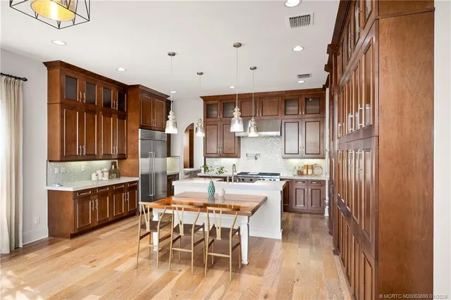 a kitchen with cabinets and appliances