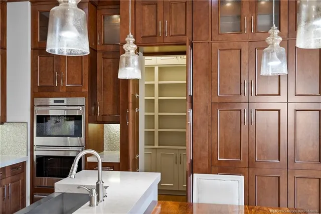 a room with a table chairs and wooden floor