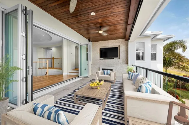 a view of a balcony with furniture