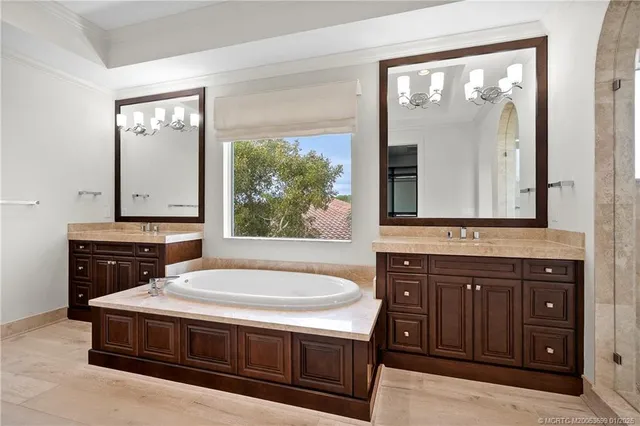 a bathroom with a shower sink and mirror