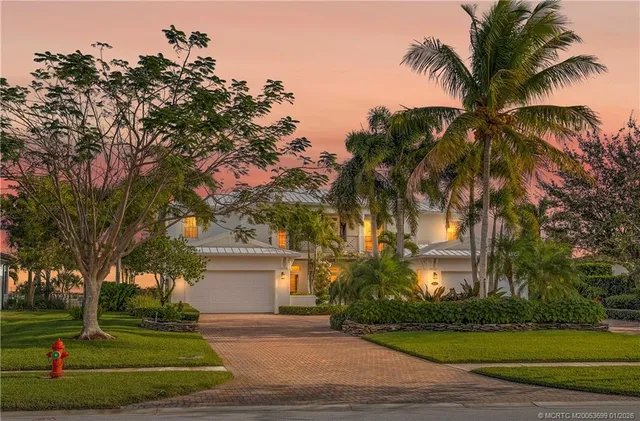 an aerial view of multiple houses with yard