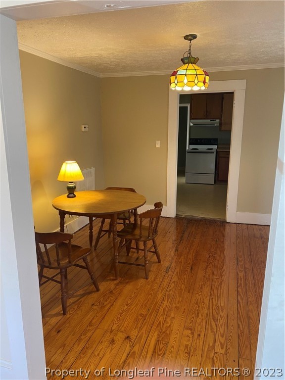 123 Smith Mill Road Lumberton, NC 28358 - Photo 6 of 17 a view of a dining room with furniture and a chandelier