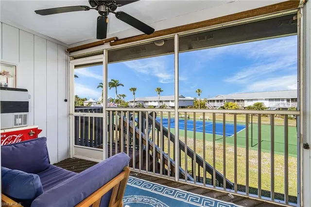 a view of a balcony with furniture