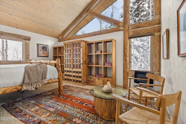 a bedroom with furniture and a window